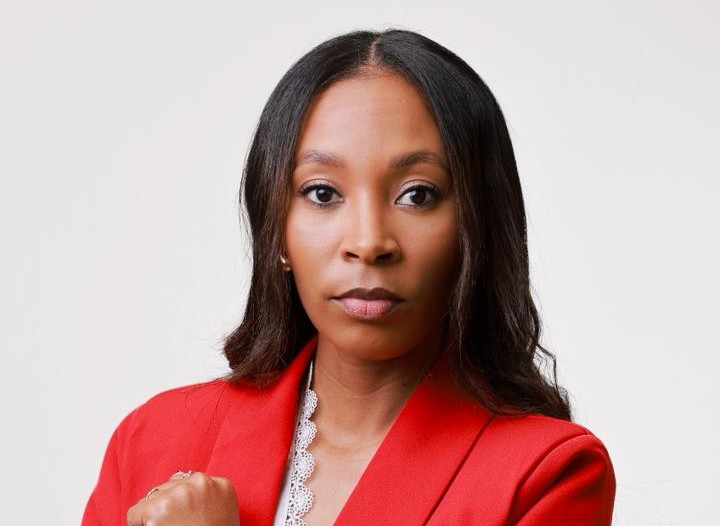Charnel-Ann Heyn - The Brief | Namibia's Leading Business & Financial News Professional headshot of a Black woman wearing a red blazer, looking at the camera.