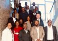 WhatsApp Image 2026-05-08 at 45602 PM - The Brief | Namibia's Leading Business & Financial News Group of diverse professionals posing on a staircase for a team photo on a corporate portrait.