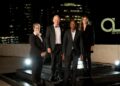 WhatsApp Image 2026-05-21 at 73528 AM - The Brief | Namibia's Leading Business & Financial News Four professionals in formal attire pose on a rooftop stage at night with city lights behind them.