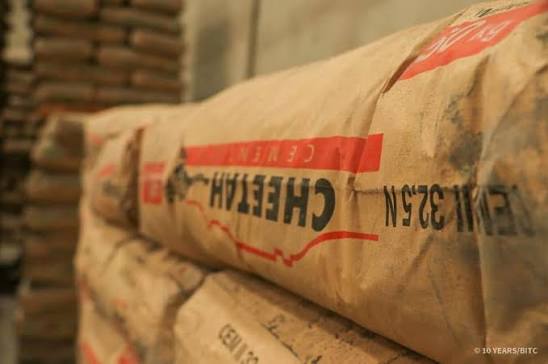 CHEETAH CEMENT - The Brief | Namibia's Leading Business & Financial News Stack of cement bags in a warehouse, beige packaging with red and black print