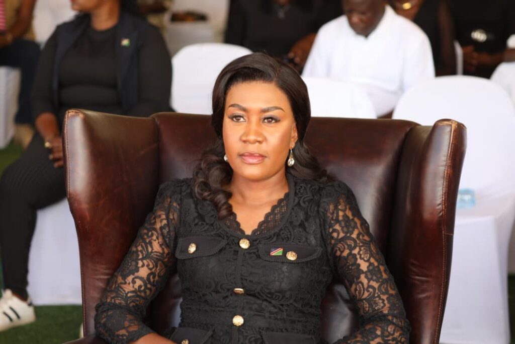 KADIVA - The Brief | Namibia's Leading Business & Financial News Woman in a black lace dress sits in a brown leather high-back chair at a formal event, with attendees behind her.