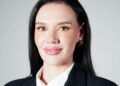 Dr Bianca van Niekerk - The Brief | Namibia's Leading Business & Financial News Head-and-shoulders portrait of a woman with dark hair wearing a black blazer and white blouse, smiling subtly.