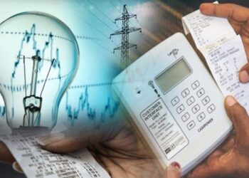 Receipt and calculator device showing electricity billing, with a glowing light bulb and power lines in the background, symbolizing energy costs and billing.