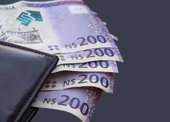 Dark leather wallet with several 200 Namibian dollar notes peeking out
