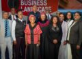 WhatsApp Image 2026-07-26 at 25037 PM - The Brief | Namibia's Leading Business & Financial News Group of diverse professionals posing for a photo at a business leadership event, with a red banner behind them reading 'BUSINESS LEADERSHIP'.