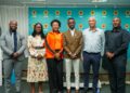 WhatsApp Image 2026-07-27 at 25914 PM - The Brief | Namibia's Leading Business & Financial News Group of six professionals posing for a photo at a corporate event, standing in front of a blue FNB backdrop.