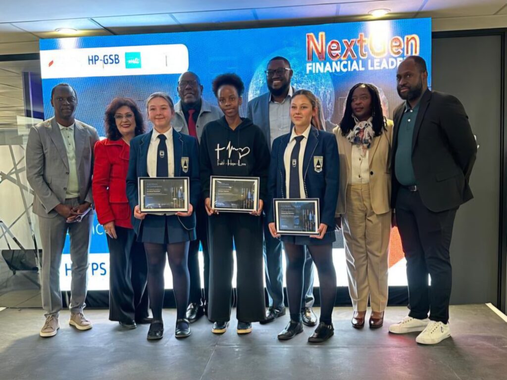 WhatsApp Image 2026-07-30 at 90241 AM - The Brief | Namibia's Leading Business & Financial News Group of award recipients and supporters pose on stage with framed plaques at the NextTen Financial Leaders event.