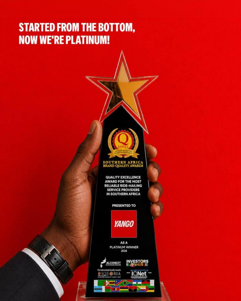 5981075404220995577_121 1 - The Brief | Namibia's Leading Business & Financial News Trophy held in a hand against a red background, text reads 'Started from the bottom, now we're platinum' with YANGO as Platinum Winner 2026.