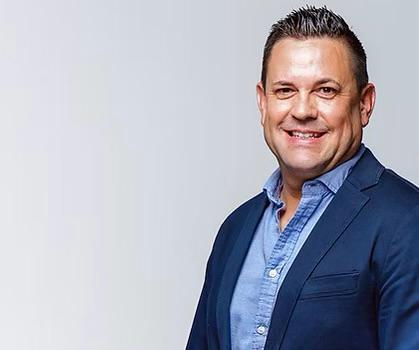 WhatsApp Image 2026-08-06 at 83945 AM - The Brief | Namibia's Leading Business & Financial News Professional head-and-shoulders photo of a smiling man in a navy blazer and light blue shirt.