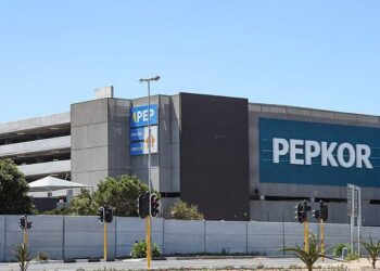 PEPKOR - The Brief | Namibia's Leading Business & Financial News Exterior view of a large gray commercial building with a prominent blue PEPKOR sign on the facade.