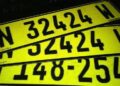 images 1 - The Brief | Namibia's Leading Business & Financial News Bright yellow license plates with large black numbers stacked diagonally in the frame, overlapping each other.