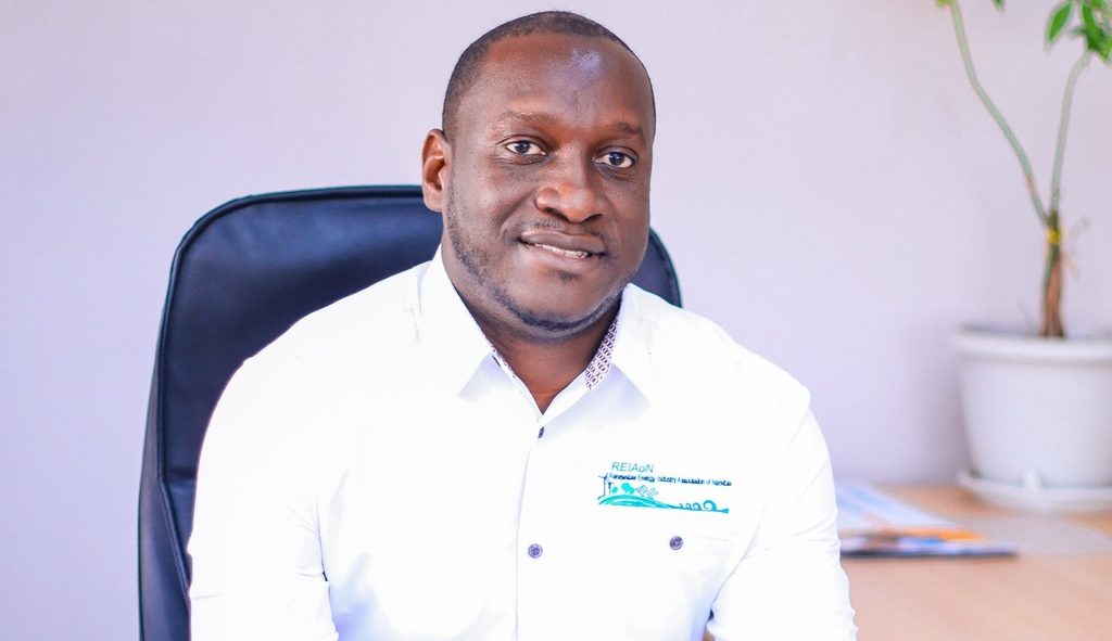 Paulus Mulunga - The Brief | Namibia's Leading Business & Financial News Man seated in an office chair, wearing a white shirt, facing the camera with a plant in the background.