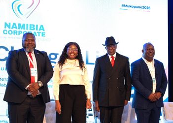 WhatsApp Image 2026-09-03 at 25150 PM - The Brief | Namibia's Leading Business & Financial News Four professionals on stage posing for a photo at a Namibia Corporate event, with a bright backdrop and branding visible behind them.