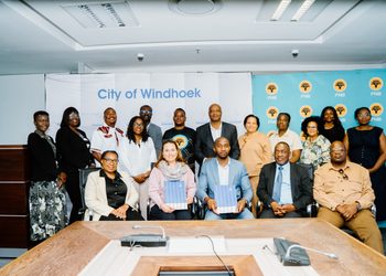 WhatsApp Image 2026-09-08 at 34313 PM - The Brief | Namibia's Leading Business & Financial News Group of men and women in business attire posing for a photo in a conference room; backdrop reads 'City of Windhoek'.