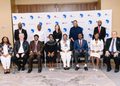 WhatsApp Image 2026-09-22 at 32808 PM - The Brief | Namibia's Leading Business & Financial News Group of 12 professionals in formal attire posing for a conference photo in front of a white backdrop with blue Africa map logos and event branding.