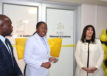 WhatsApp Image 2026-09-24 at 114618 AM - The Brief | Namibia's Leading Business & Financial News Three professionals at a ribbon-cutting ceremony for the National AI Institute, with yellow cushions and balloons nearby.