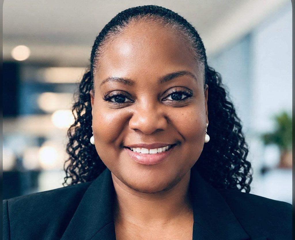 Linda Shininge - The Brief | Namibia's Leading Business & Financial News Smiling Black woman in a black blazer with pearl earrings, in an office setting (close-up portrait).