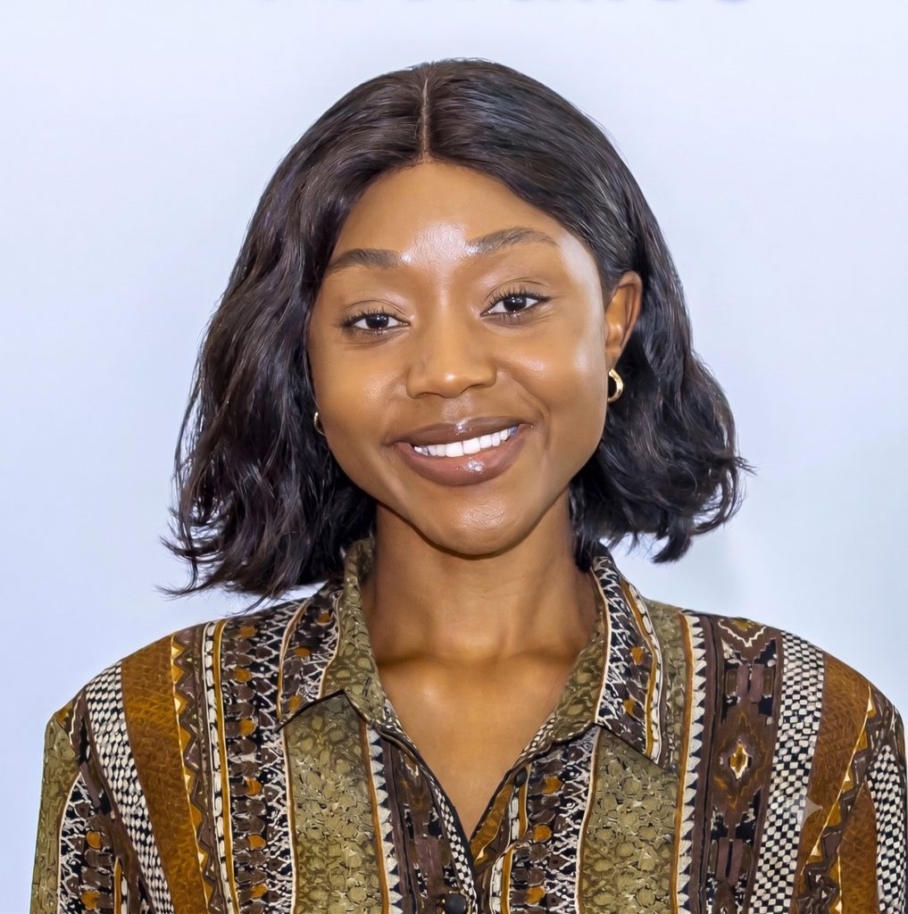 Dr Tuwilika Nafuka3 - The Brief | Namibia's Leading Business & Financial News Portrait of a smiling woman with shoulder-length dark hair wearing a brown and green patterned blouse against a light background.