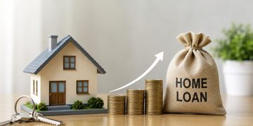 Model house beside coin stacks and a burlap bag labeled HOME LOAN, with an upward arrow suggesting growth.
