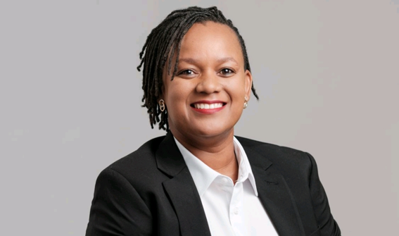 Stephanie De Klerk - The Brief | Namibia's Leading Business & Financial News Professional headshot of a smiling woman in a black blazer and white shirt, against a light gray background.